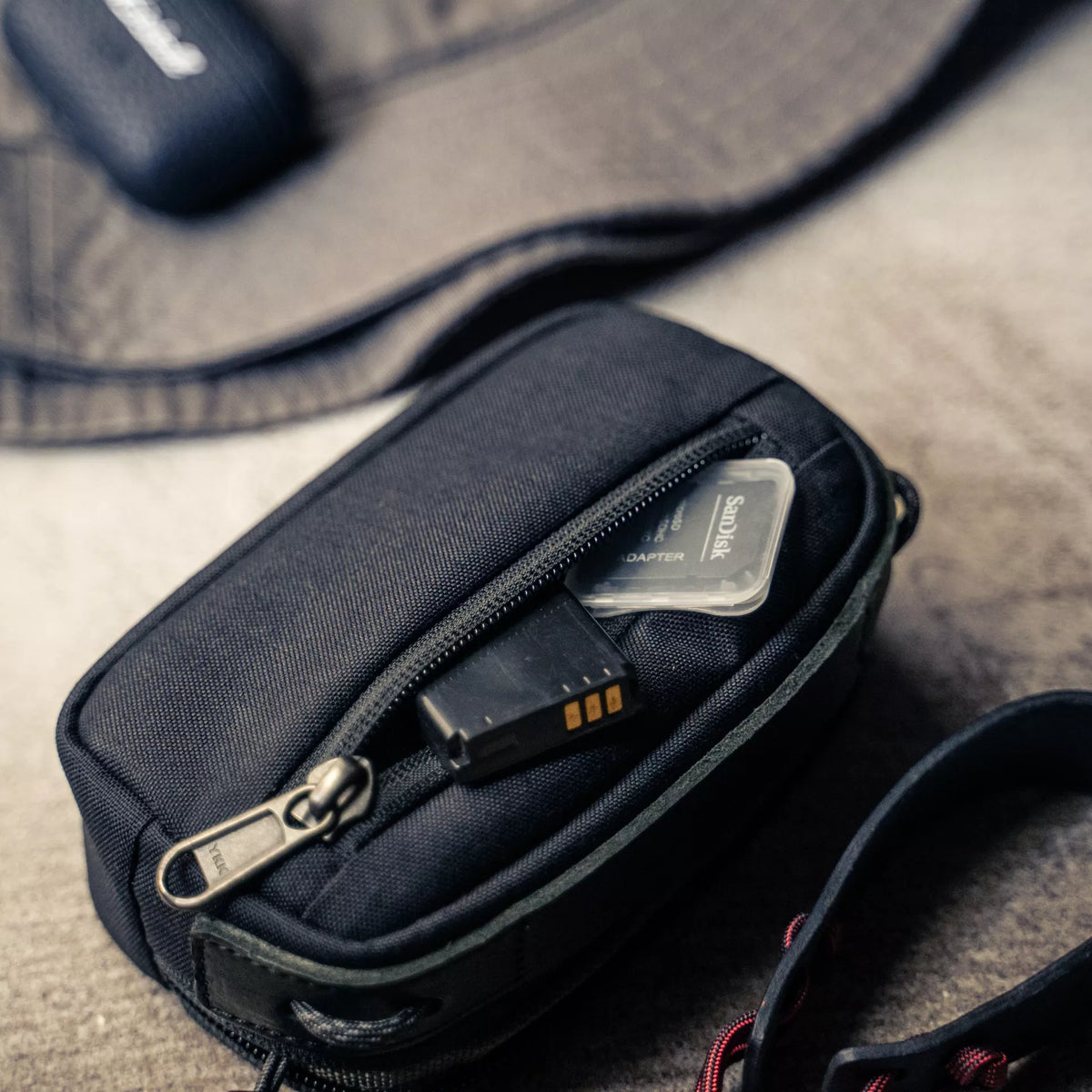 Wotancraft small black canvas pouch front pocket with battery and SD card