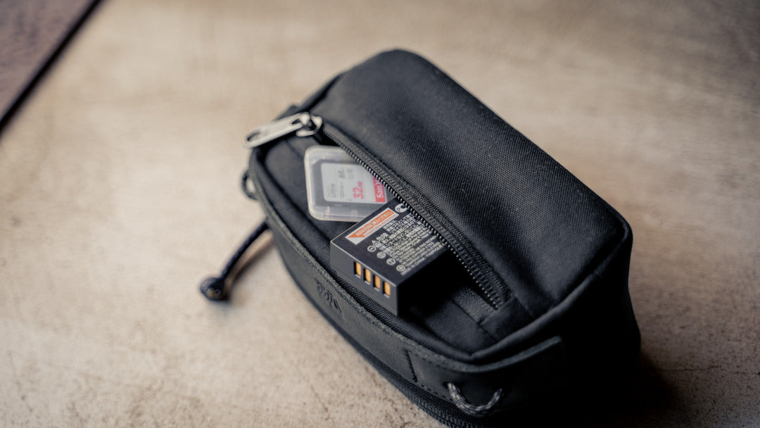 Wotancraft small black canvas pouch with spare battery and SD card in the pocket