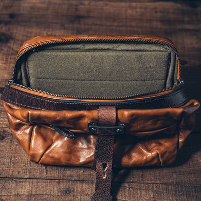 Wotancraft Mini Rider brown leather bag open, showing the olive lining