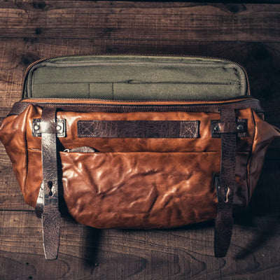 Wotancraft Night Rider brown leather bag open from above, showing the olive lining