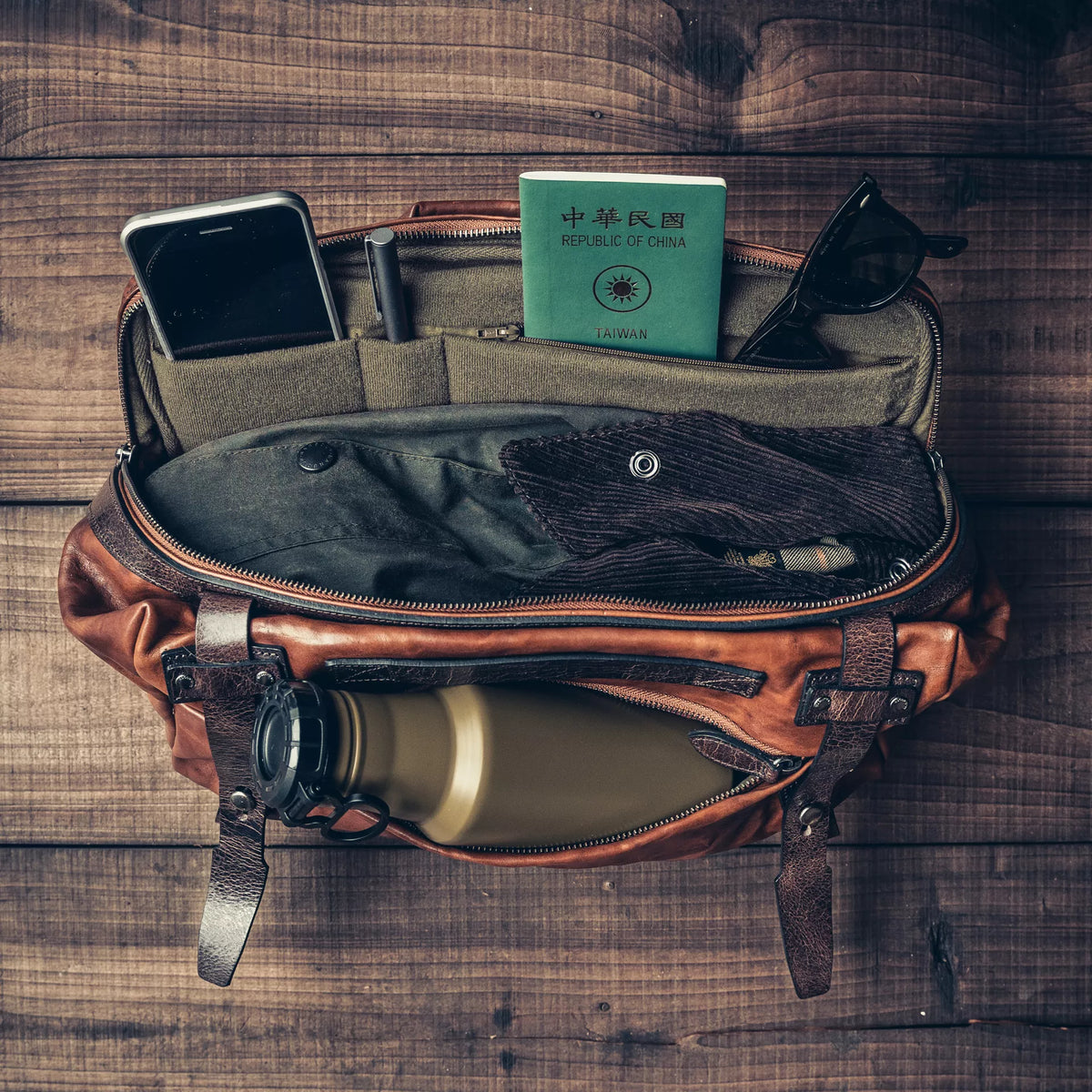 Wotancraft Night Rider brown leather bag with phone, passport and water bottle