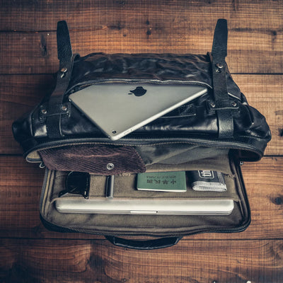 Wotancraft Lightning Rider black leather bag from above with tablet, passport and laptop