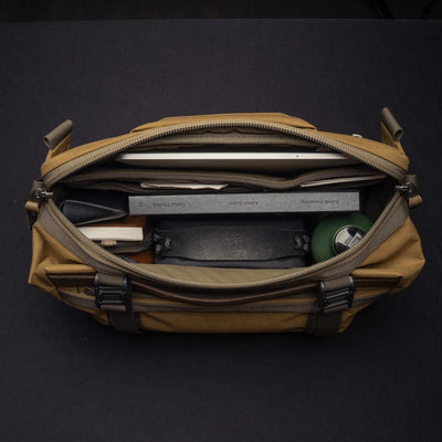Wotancraft Easy Rider khaki bag open from above with tablet, wallet and bottle