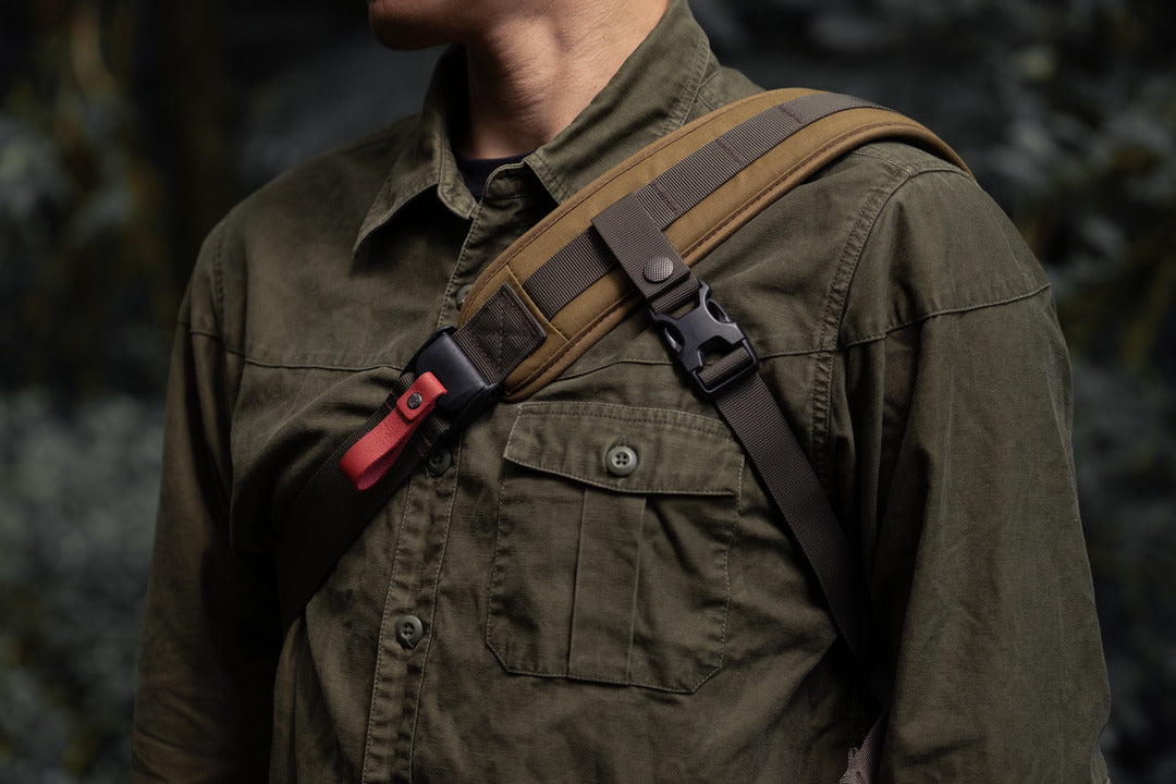 Wotancraft Lightning Rider shoulder strap with red quick-release buckle, worn
