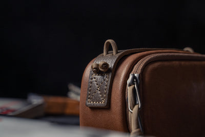 Wotancraft leather camera pouch side tab and zip close-up