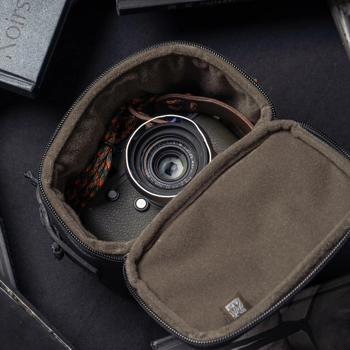 Wotancraft black leather pouch open with an olive Leica M inside