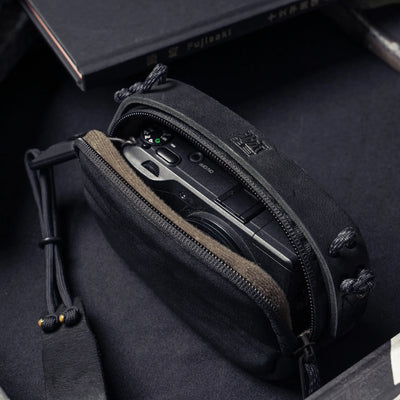 Wotancraft black leather small pouch open with a Ricoh GR inside