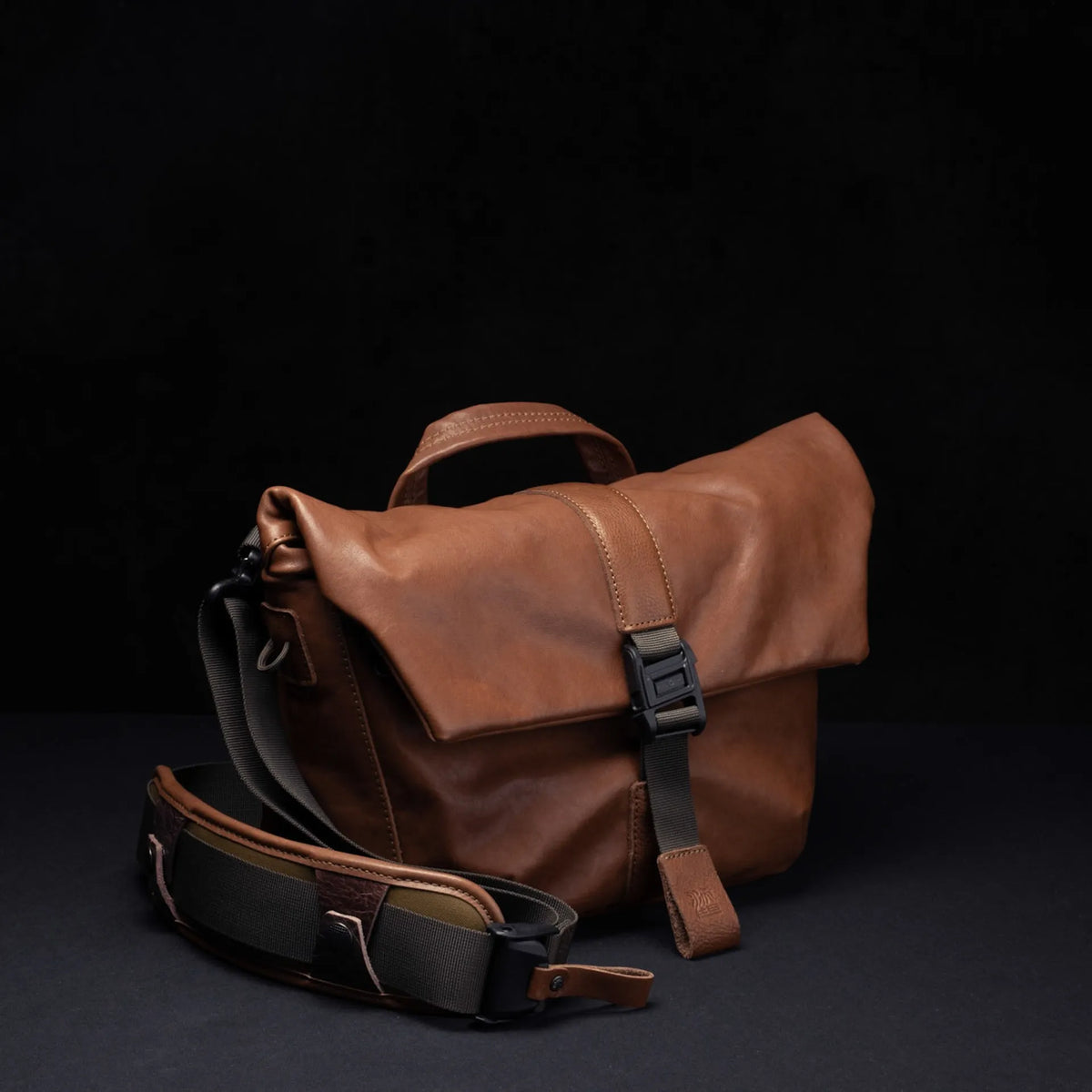 Wotancraft Pilot 7L brown leather bag with shoulder strap on a dark background