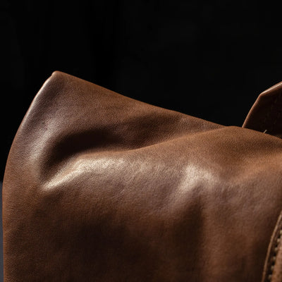 Wotancraft Pilot brown leather flap close-up showing the leather grain