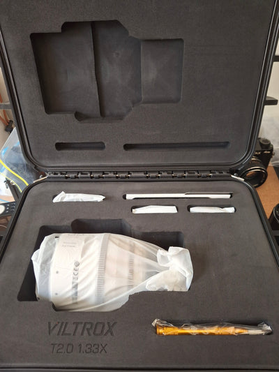 Viltrox T2.0 1.33x anamorphic lens hard case open, lens and accessories in foam
