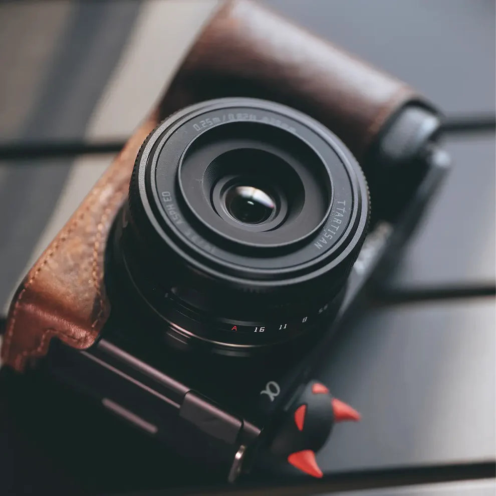 TTArtisan AF 14mm f/3.5 on a Sony camera with brown leather half case