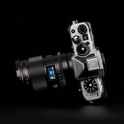 Viltrox AF 16mm f/1.8 Z mounted on a silver Nikon Zf camera, top view