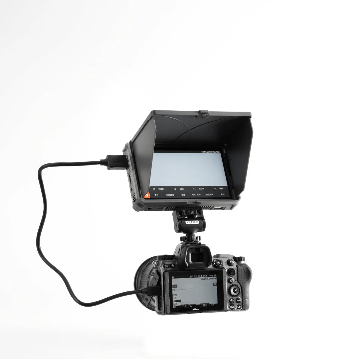 Viltrox DC-X monitor with sunshade mounted on a Nikon camera via HDMI cable