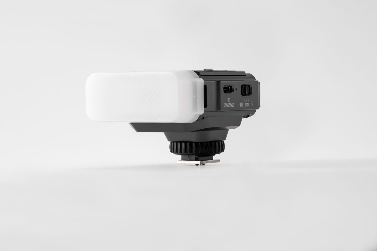 Viltrox Spark Z3 flash with diffuser on grey, side view