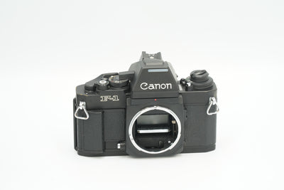 Canon New F-1 black SLR body, straight-on front view