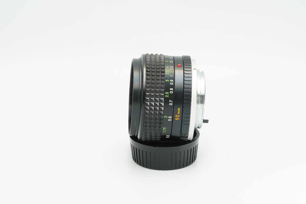 Minolta MC Rokkor-PG 50mm f/1.4, side profile with aperture ring