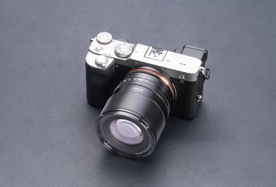 TTArtisan AF 75mm f/2 lens mounted on a silver mirrorless camera