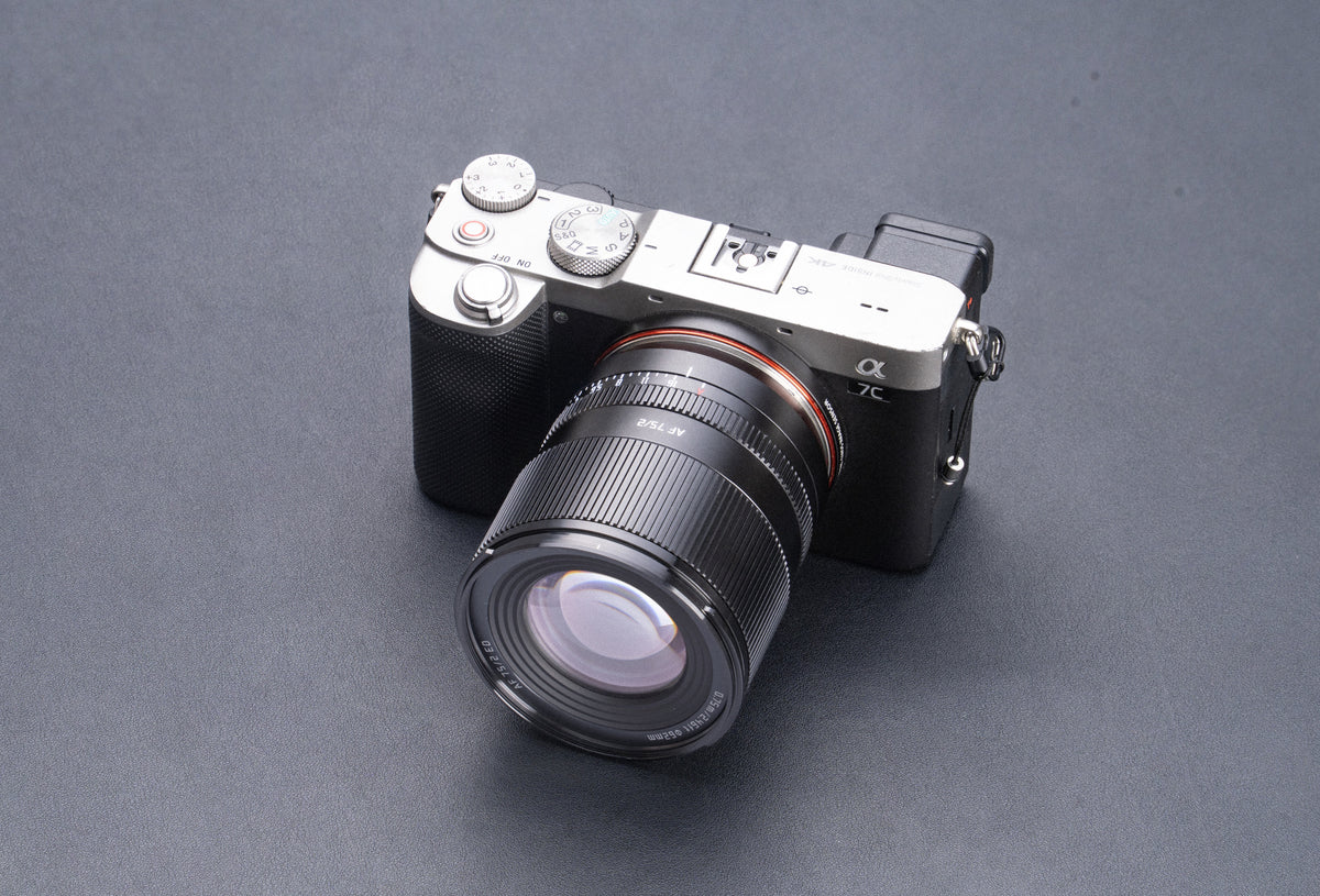 TTArtisan AF 75mm f/2 lens mounted on a silver mirrorless camera