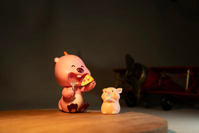 Toy figures lit by the TTArtisan mini LED light, warm light sample
