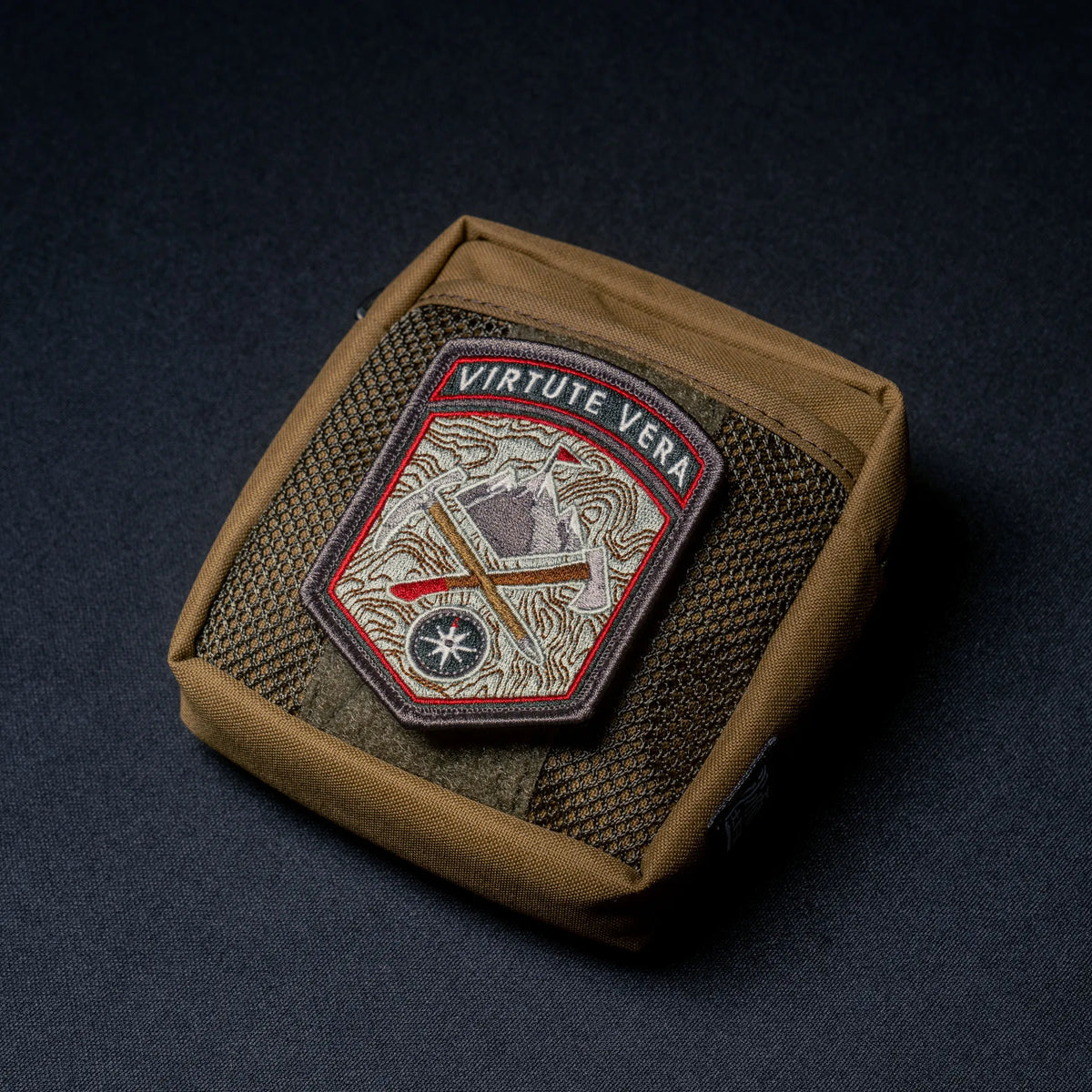 Wotancraft brown Armor 5 pocket with a Virtute Vera patch on the hook-and-loop panel