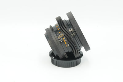 Canon FD 50mm f/1.4 S.S.C. cine mod, side view with focus gear and slip-on cap