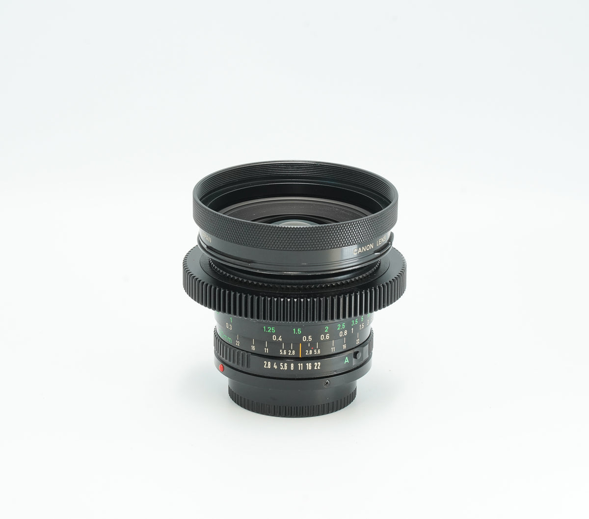 Canon nFD 20mm f/2.8 cine-modded with focus gear and metal hood
