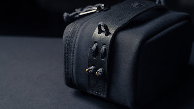 Wotancraft black canvas pouch leather tab and paracord loops close-up