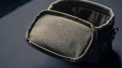 Wotancraft camera pouch open, showing the soft olive lining