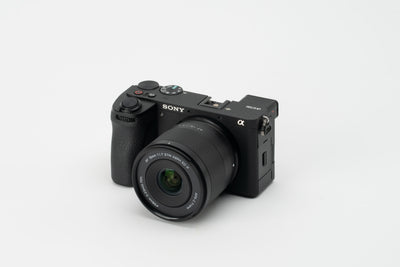 Viltrox Air AF 15mm f/1.7 mounted on a Sony A6700, on a grey background