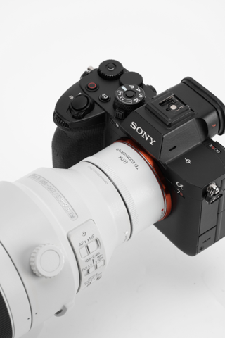 Viltrox 2.0x teleconverter on a Sony A7 IV, top view of the camera