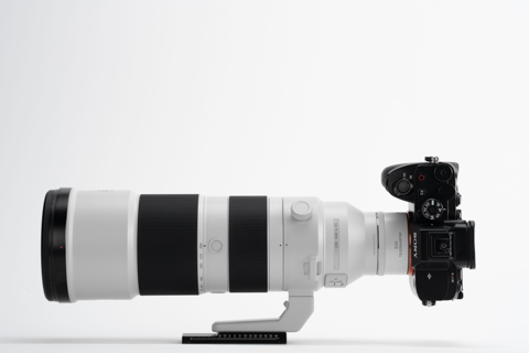 Sony camera with Viltrox 2.0x teleconverter and 200-600mm lens on a tripod foot, side view