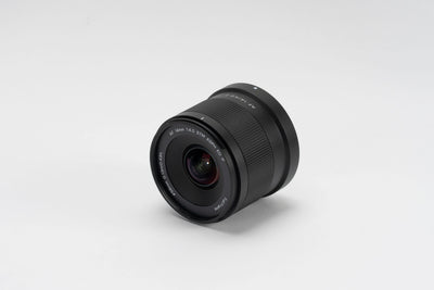 Viltrox Air AF 14mm f/4 Nikon Z lens, angled front view on grey background