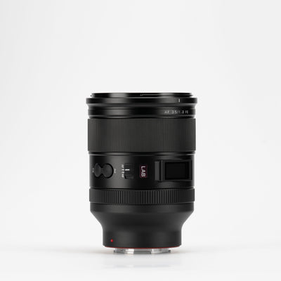 Viltrox LAB AF 35mm f/1.2 FE Sony E lens on a light grey background, side view