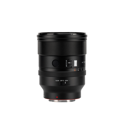 Viltrox AF 85mm f/1.4 Pro FE lens showing the focus hold button and de-click aperture switch