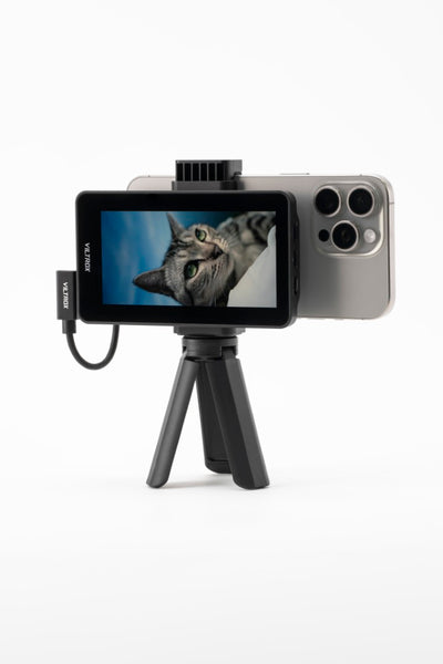 Viltrox DC-T1 showing an iPhone camera feed of a cat, on a mini tripod