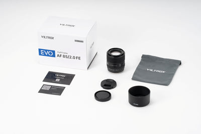 Viltrox AF 85mm f/2.0 FE EVO box contents: lens, hood, pouch, caps and cards