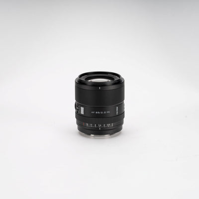 Viltrox AF 85mm f/2.0 FE compact portrait lens on a light grey background