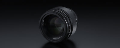Voigtlander Nokton 50mm f/1.0, angled view of the front element on black