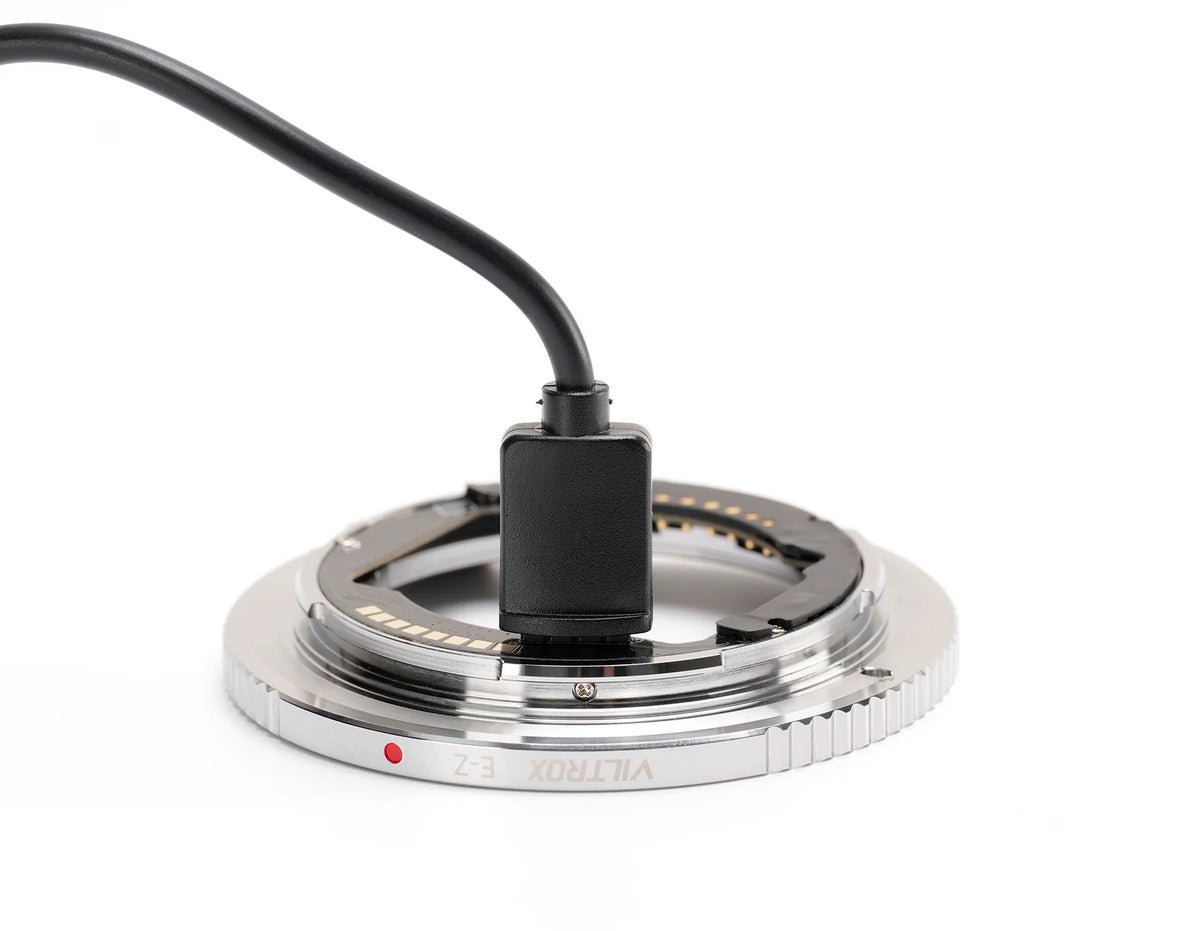 Viltrox E-Z adapter connected to a USB cable for firmware updates