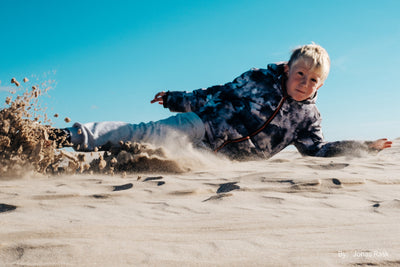 Child sliding down a sand dune, TTArtisan AF 27mm f/2.8 sample