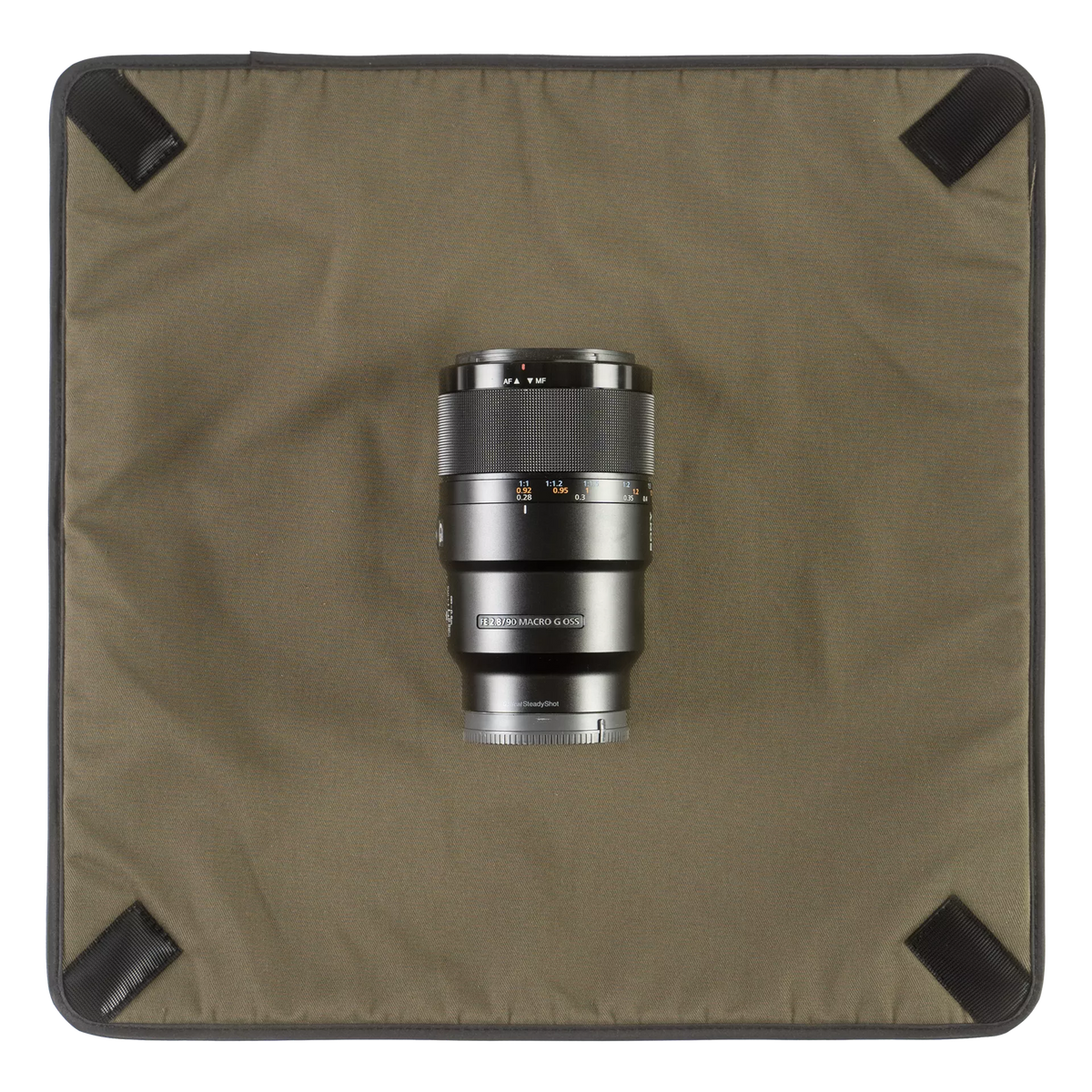 Wotancraft Magician Wrap laid flat with a Sony telephoto lens
