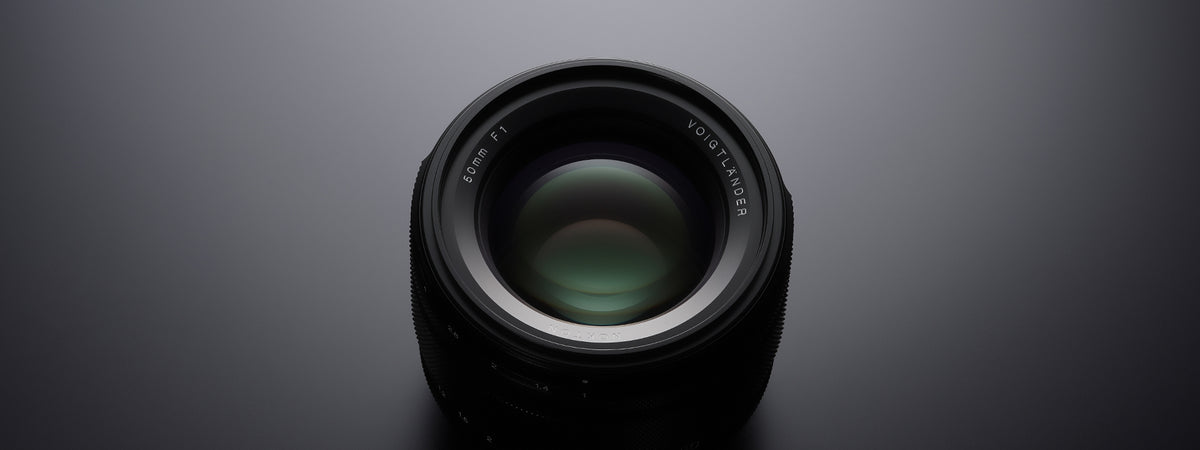 Voigtlander Nokton 50mm f/1.0 Asph front element on a dark background