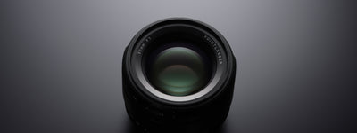 Voigtlander Nokton 50mm f/1.0 Asph front element on a dark background