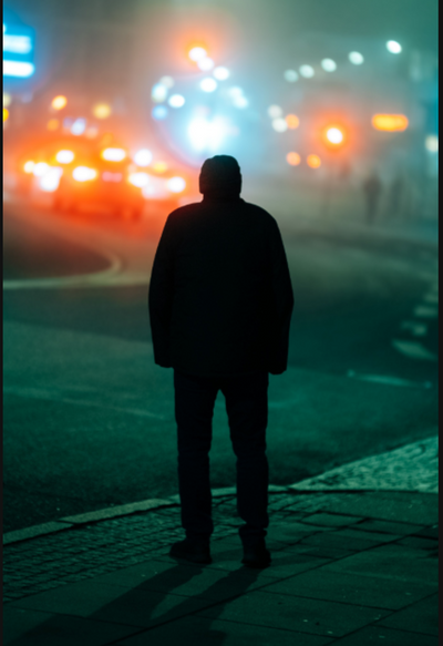 Man standing on a foggy street at night with car lights, sample from the Thypoch Simera 75mm f/1.4