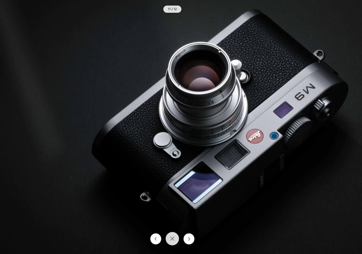 Silver Leica M9 with the Thypoch Eureka 50mm f/2 on a dark background