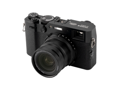 Black Fujifilm X100 with the Viltrox 0.8x wide converter fitted