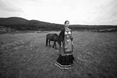 Black and white portrait of a woman with a horse, sample from the Thypoch Simera-C 16mm