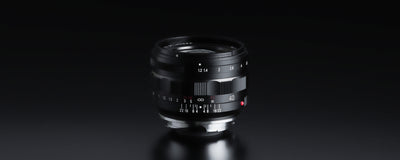 Voigtlander Nokton 40mm f/1.2 Leica M lens on black, side view with scales