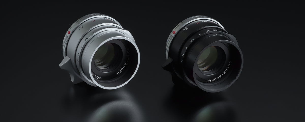 Voigtlander Color-Skopar 50mm f/2.2 Leica M lenses in silver and black, front view