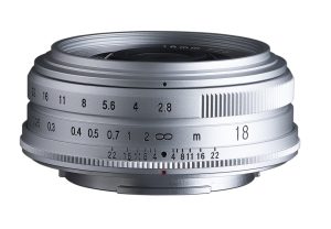 Voigtlander Color-Skopar 18mm f/2.8 pancake lens for Fujifilm X in silver, side view